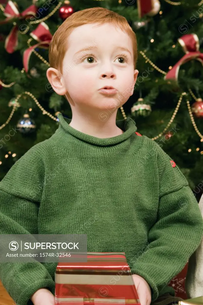 Boy holding a Christmas present