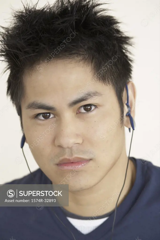Portrait of a teenage boy listening to music