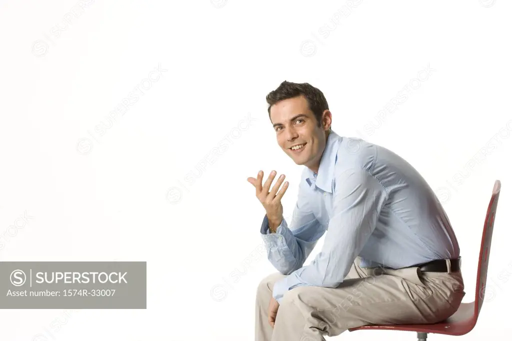 Businessman sitting in a chair and smiling