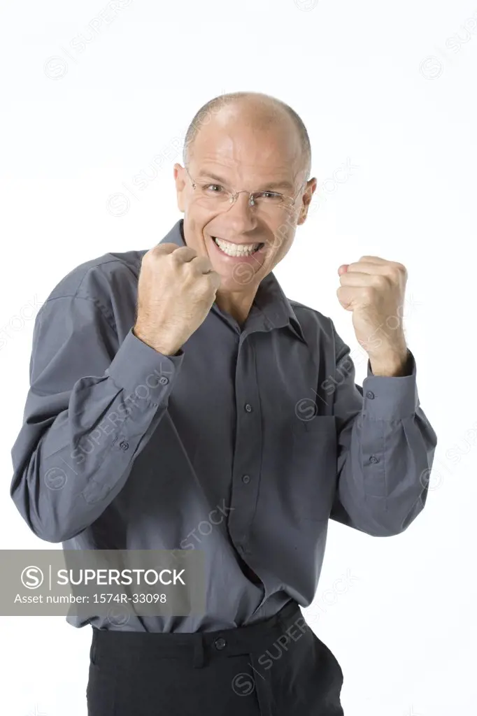 Businessman clenching his teeth in excitement
