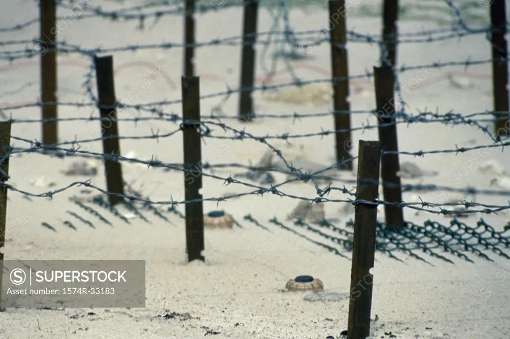 High angle view of land mines and barbed wire