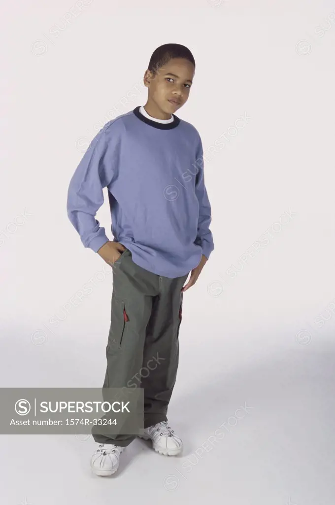 Portrait of a boy standing with his hands in his pockets