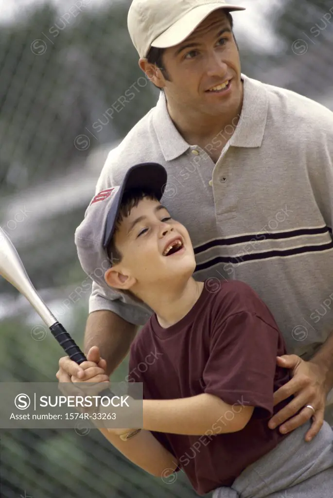 Father and his son playing baseball