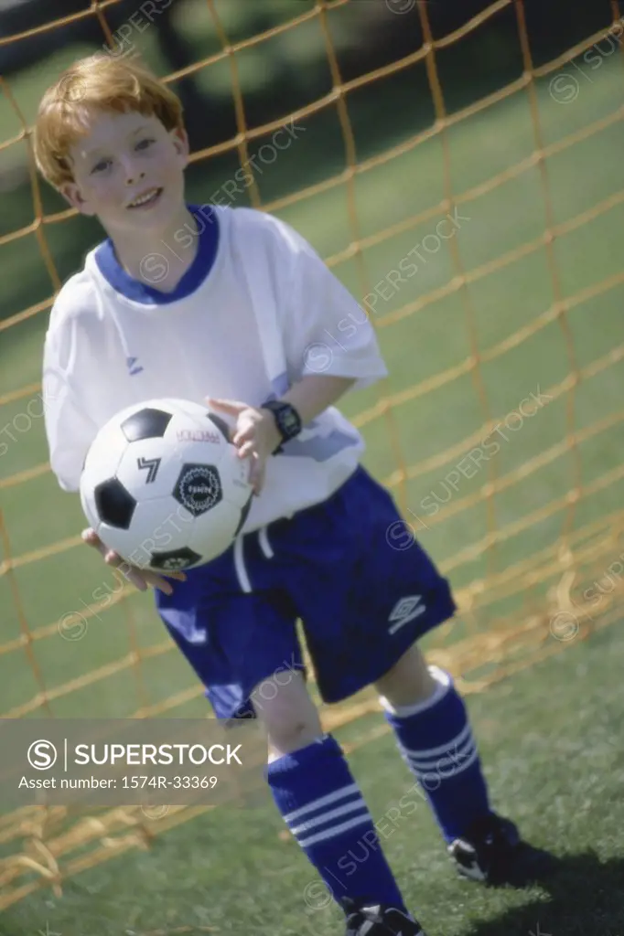 Portrait of a goalie holding a soccer ball