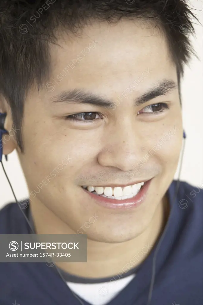 Close-up of a teenage boy listening to music