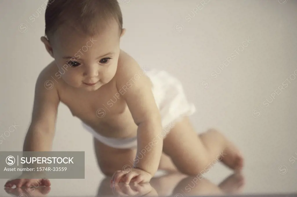 Baby girl crawling on the floor