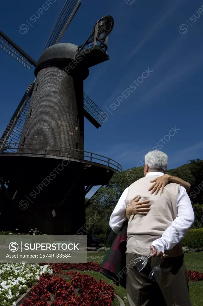 Mature couple being romantic in a park, Golden Gate Park, San Francisco, California, USA