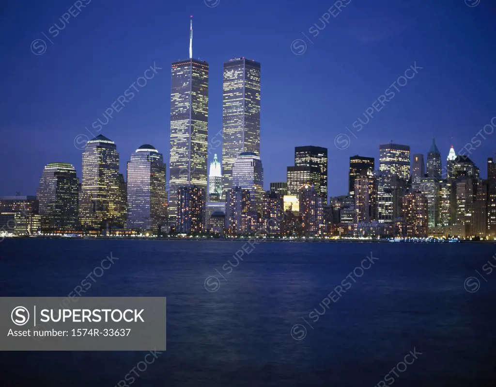 Skyscrapers on the waterfront lit up at night, World Trade Center, Manhattan, New York City, New York, USA