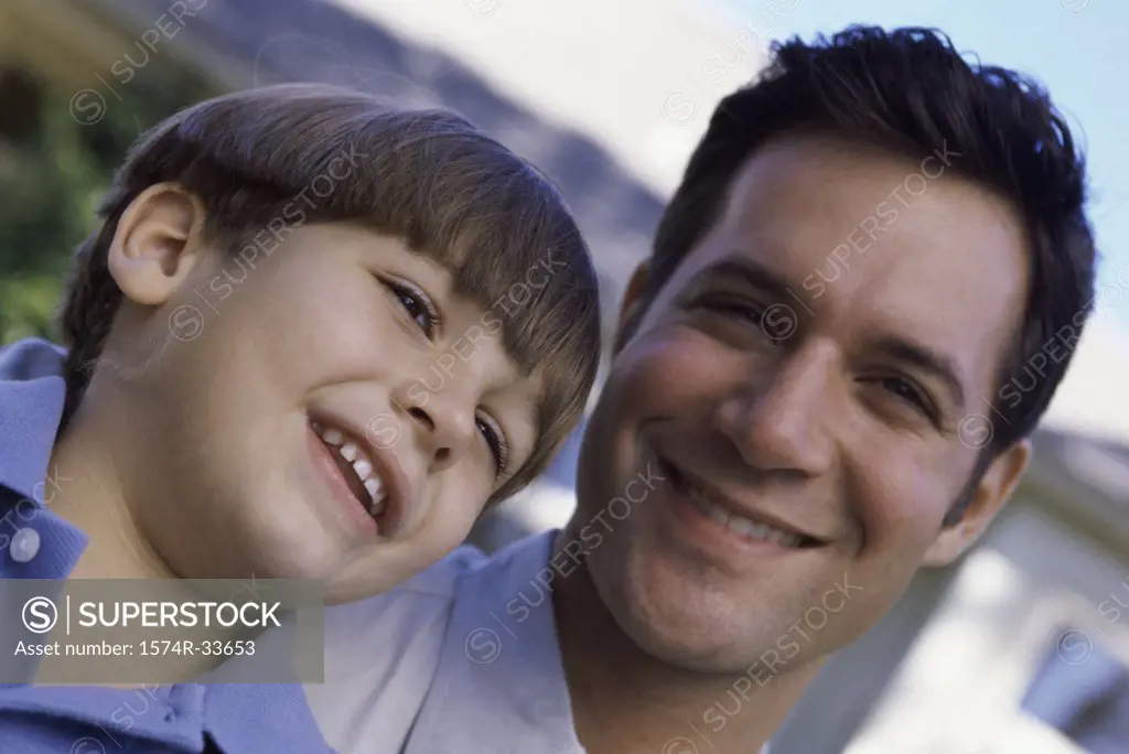 Portrait of a father and son smiling