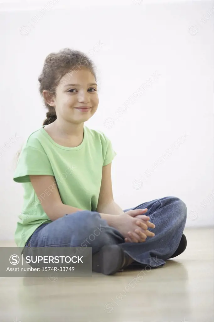 Portrait of a girl sitting on the floor