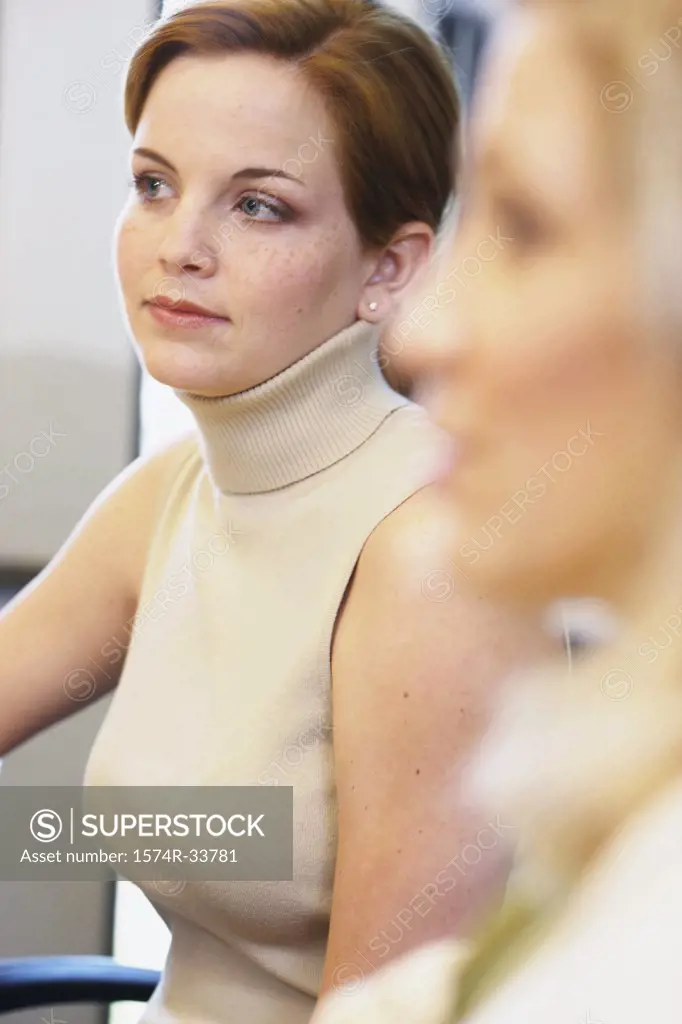 Side profile of a businesswoman sitting in an office