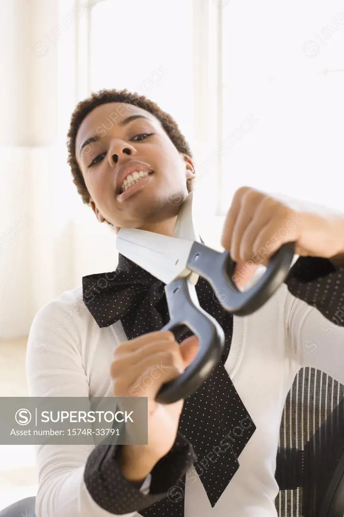Businesswoman attempting to cut her neck with a pair of oversized scissors