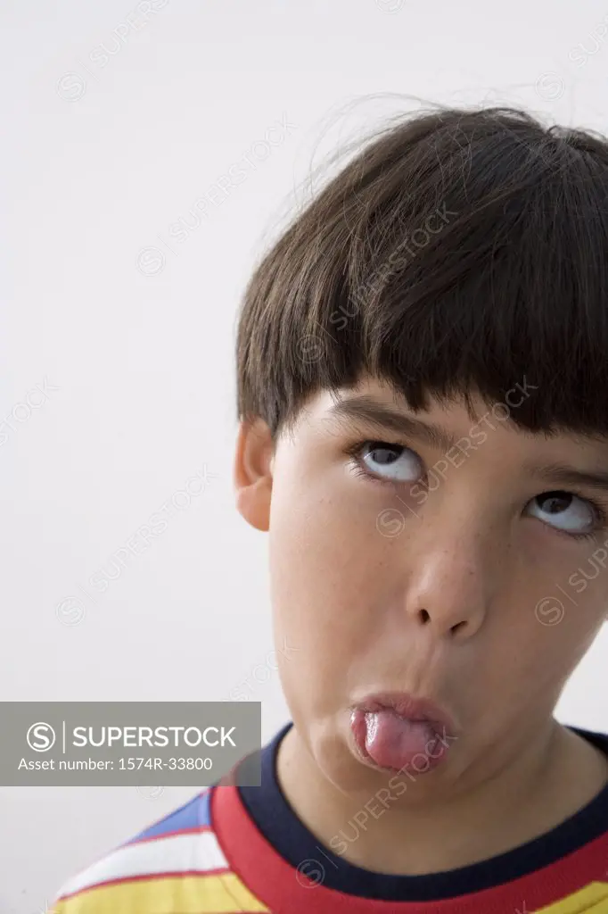 Close-up of a boy sticking his tongue out