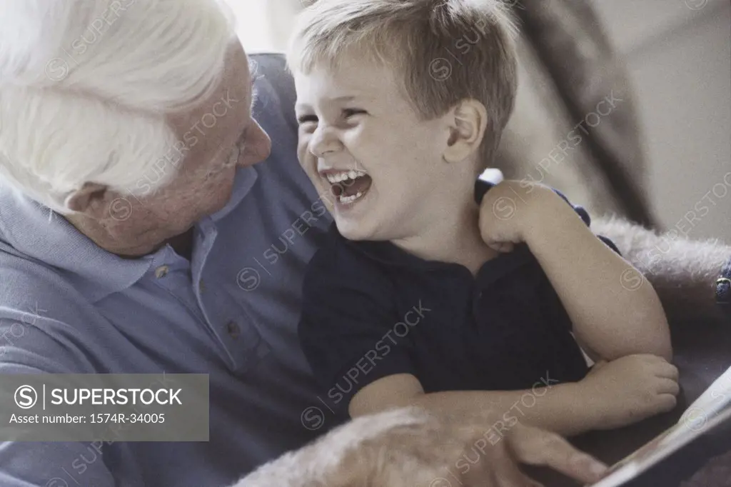 Grandfather and his grandson laughing