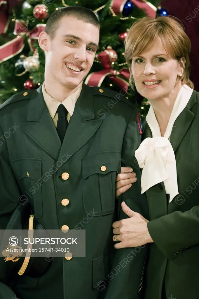 Young man in a uniform standing with his mother