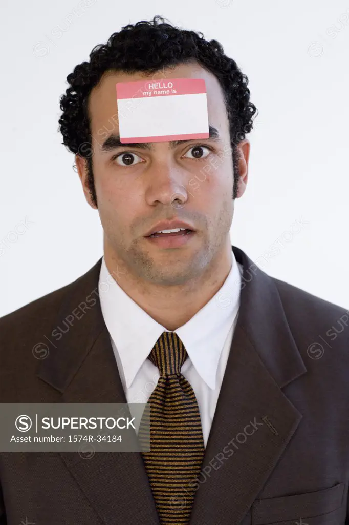 Portrait of a businessman with a name tag on his forehead