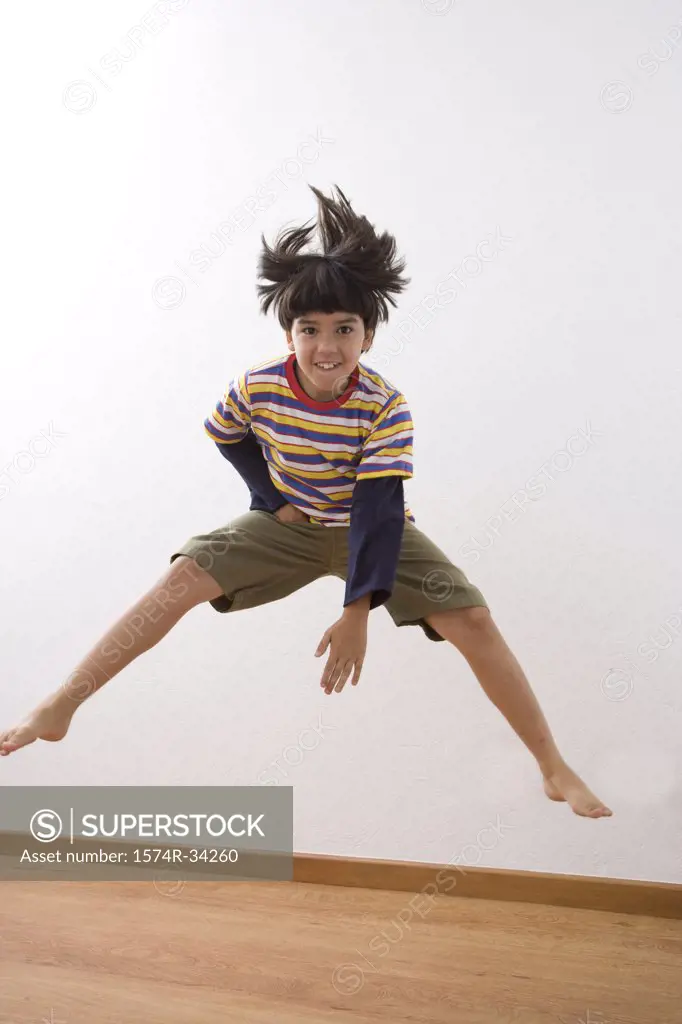 Boy jumping and smiling