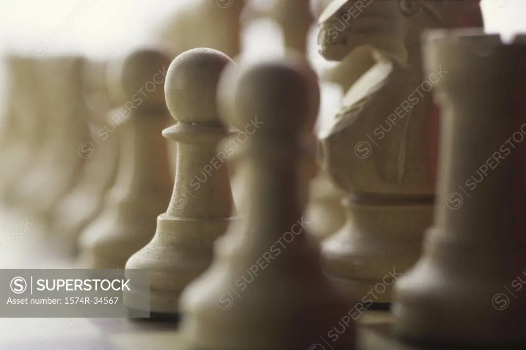 Close-up of chess pieces on a chessboard