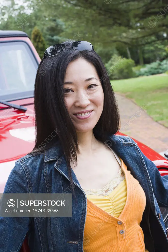 Happy woman smiling in front of a jeep