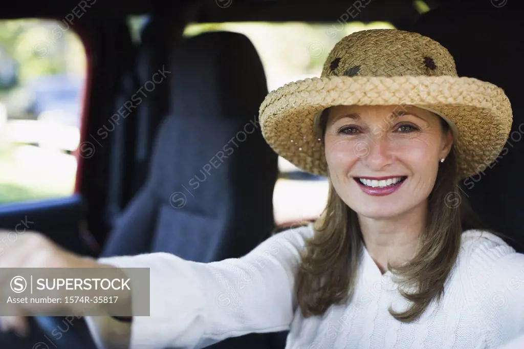 Woman driving a jeep and smiling