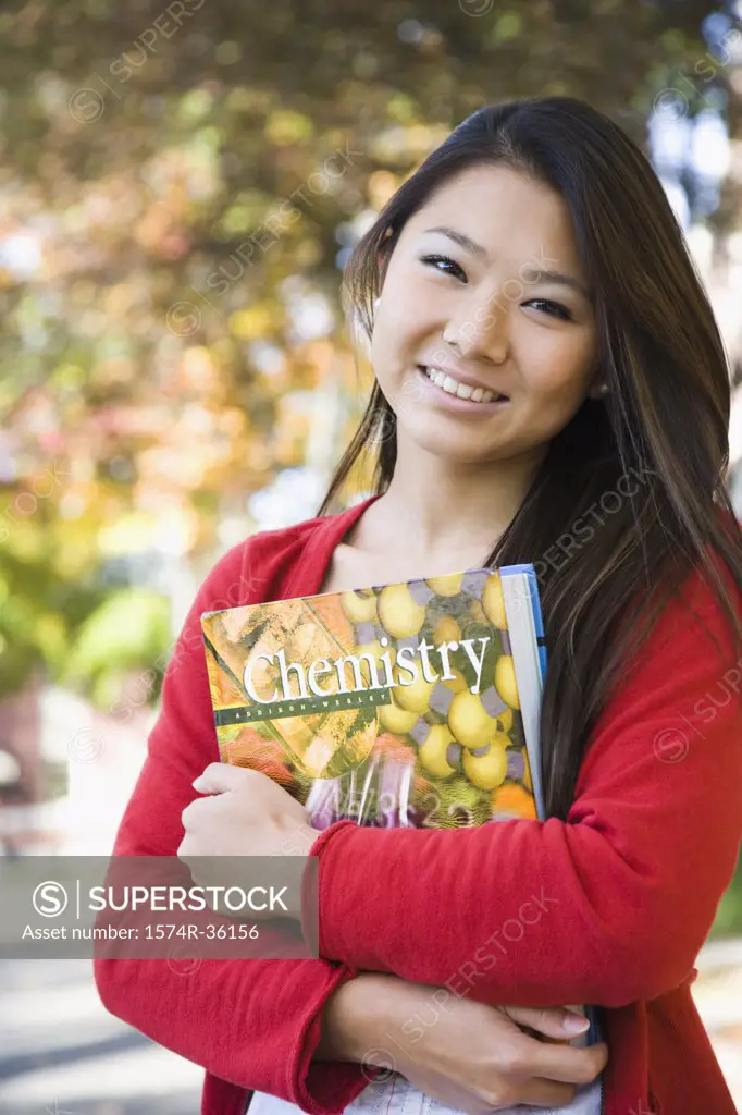 Student holding a chemistry book