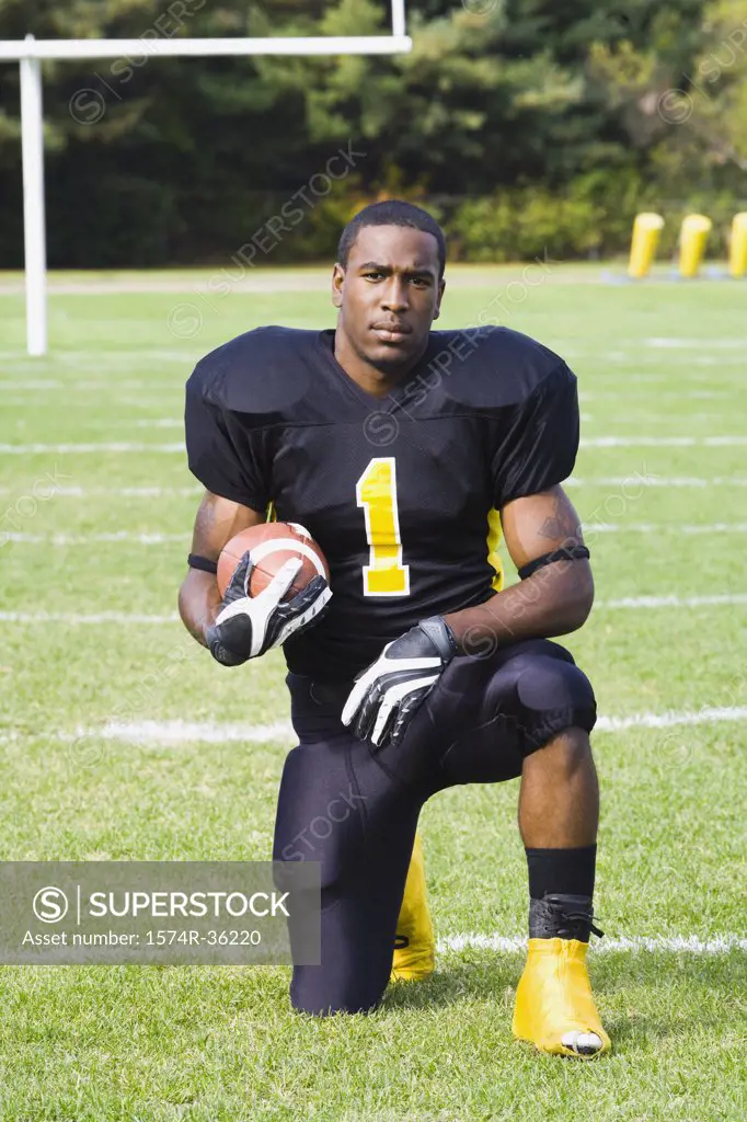 Portrait of a football player in a field