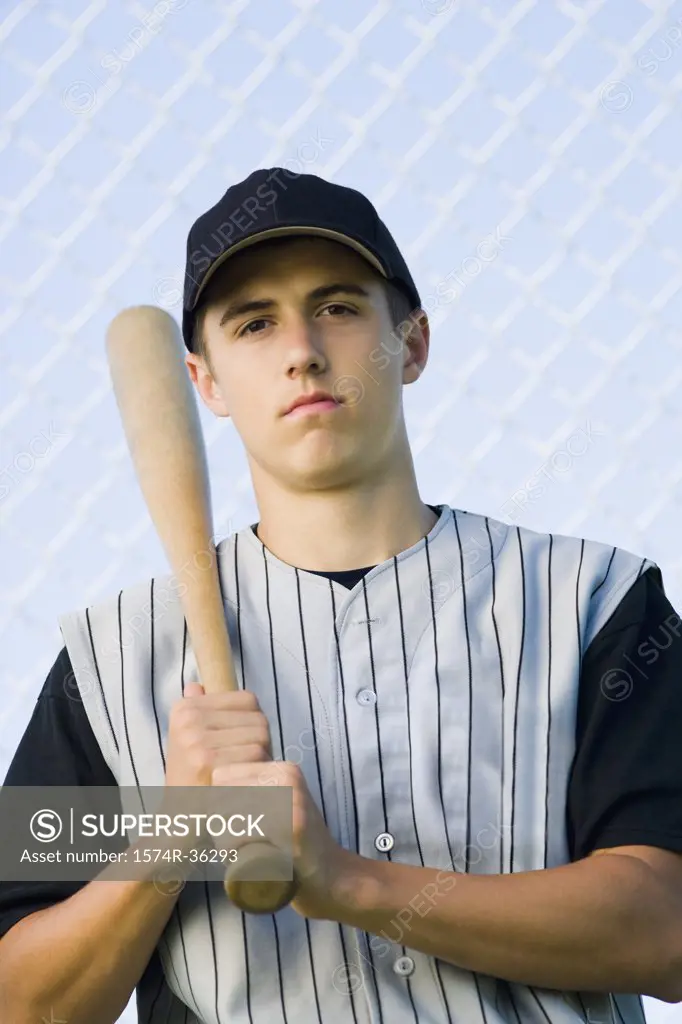 Portrait of a teenage boy holding a baseball bat
