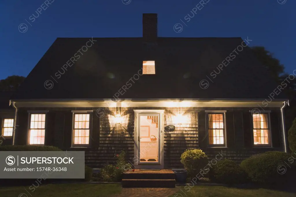 House lit up at dusk