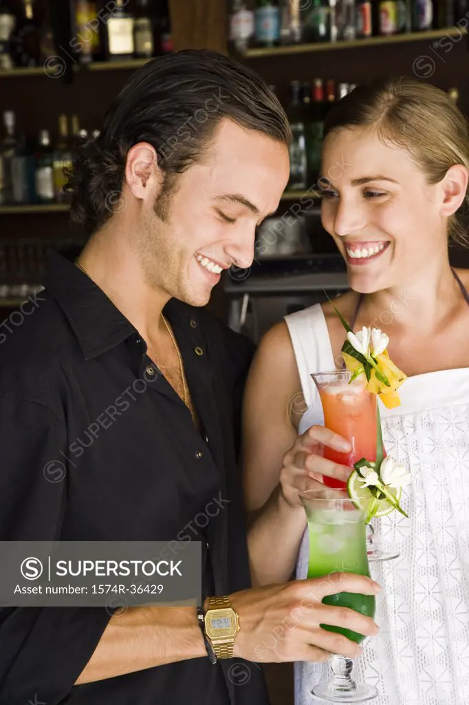 Close-up of a couple enjoying cocktail, Papeete, Tahiti, French Polynesia