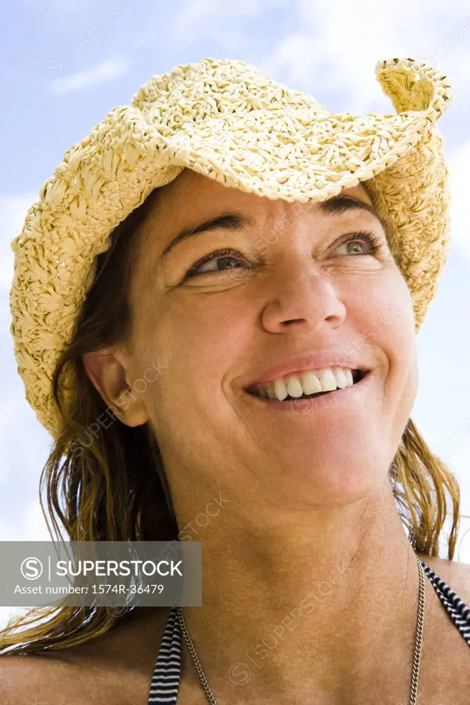Close-up of a woman wearing a hat and smiling, Tahaa, Tahiti, French Polynesia