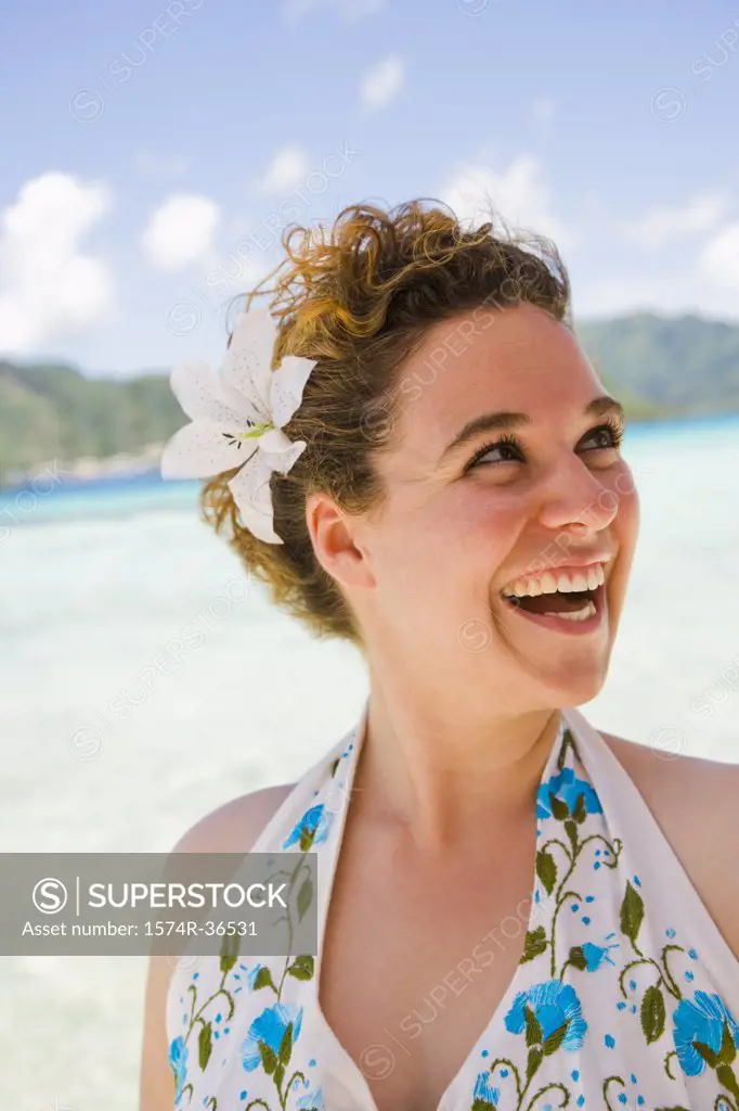 Woman laughing on the beach, Tahaa, Tahiti, French Polynesia