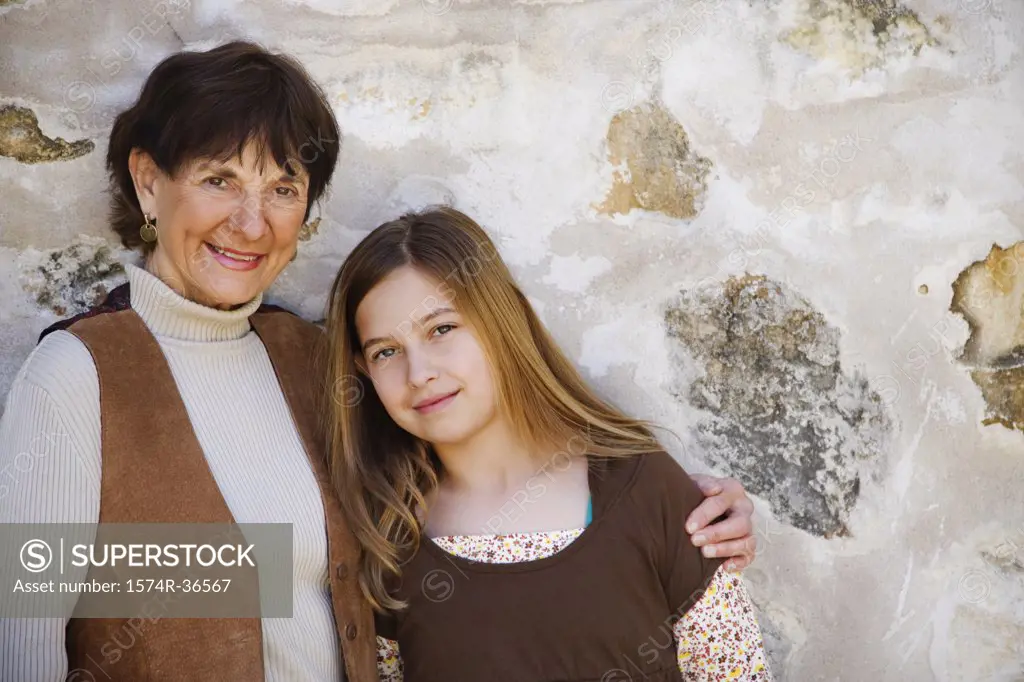 Woman arm around her granddaughter