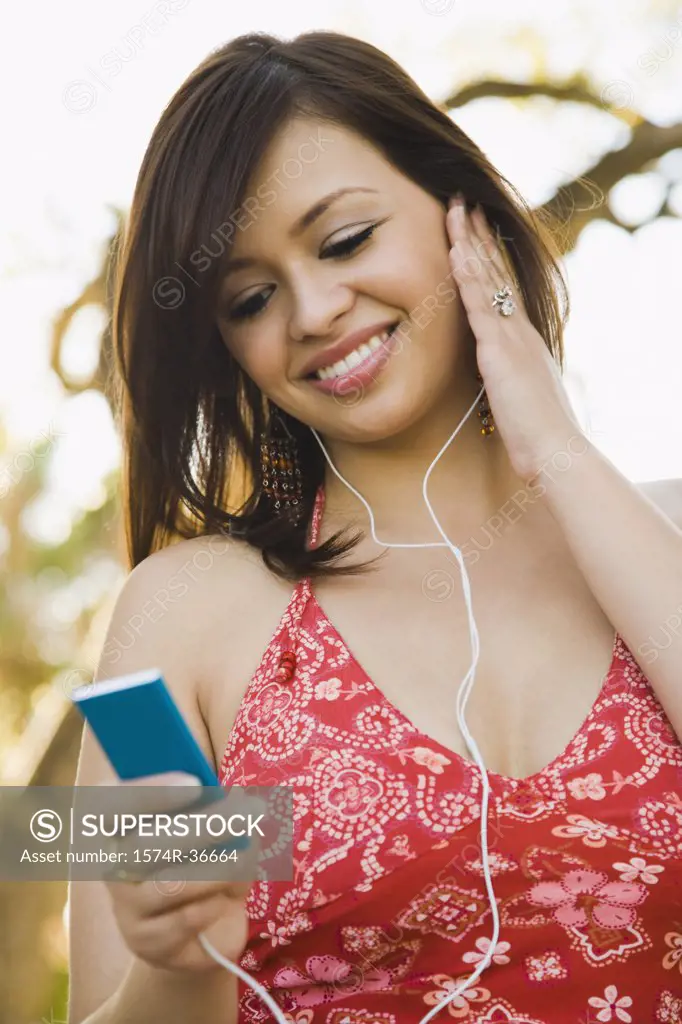 Woman listening to an MP3 player