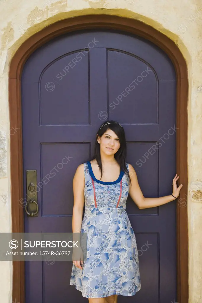 Woman standing in front of a door