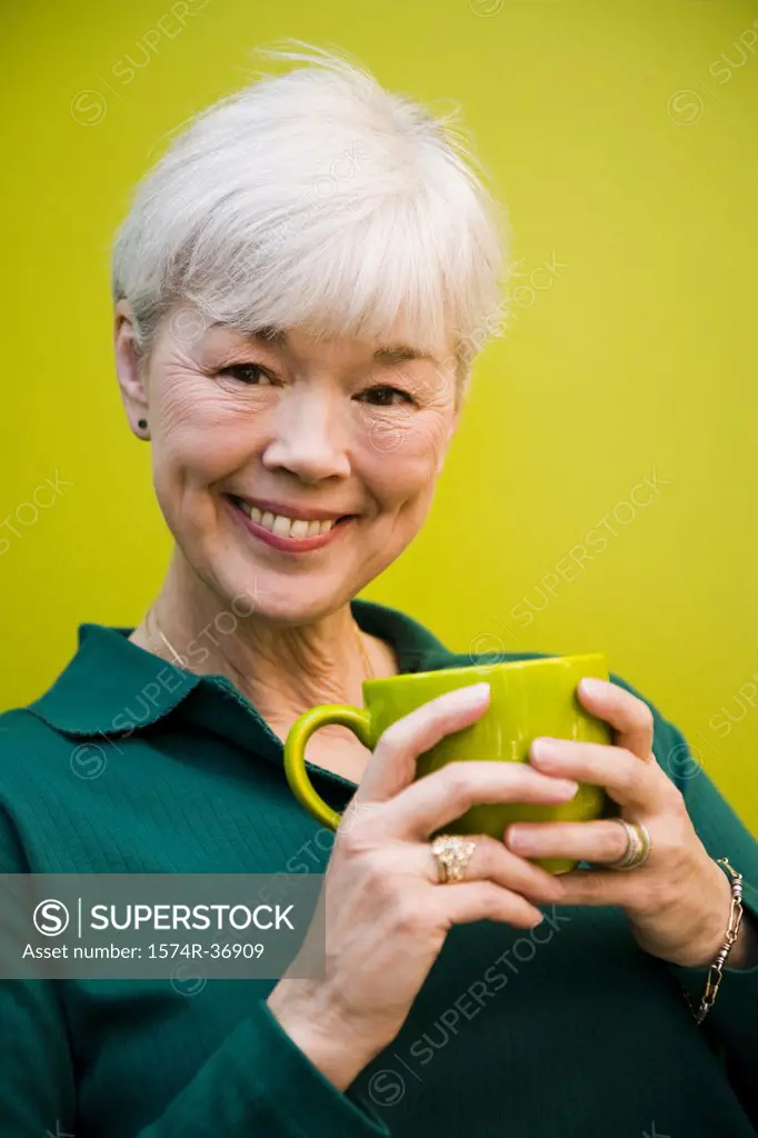 Portrait of a woman holding a cup of coffee