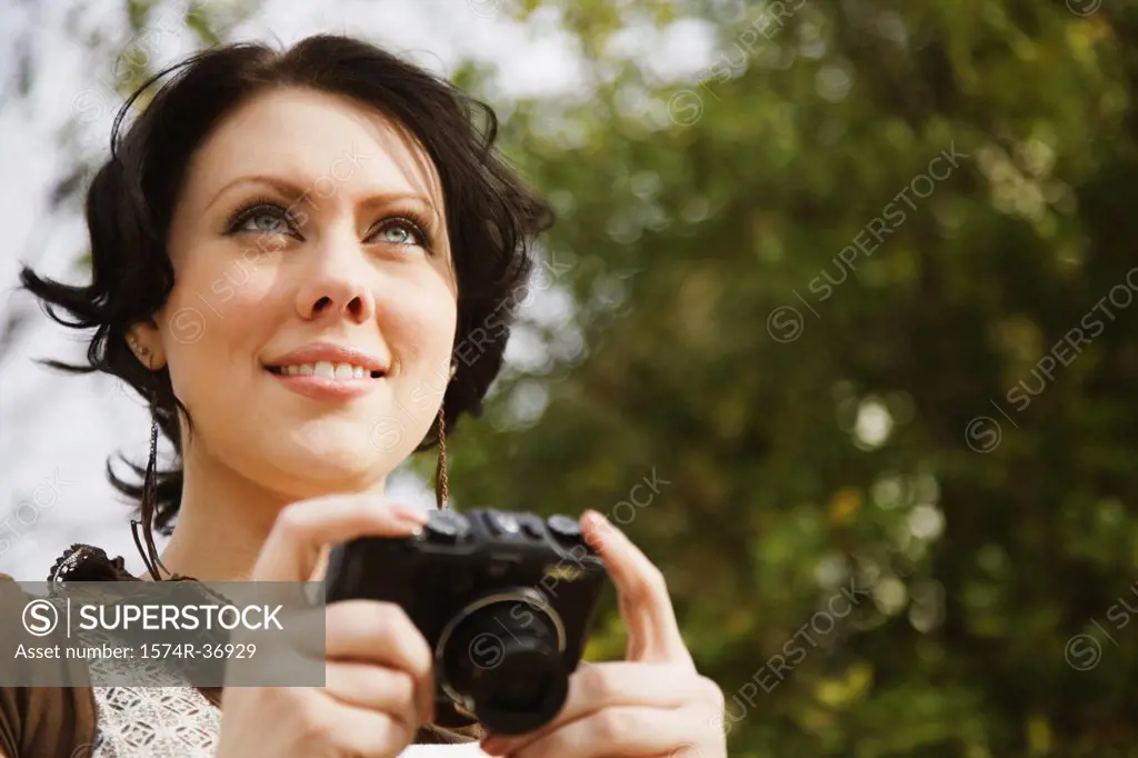 Woman holding a digital camera