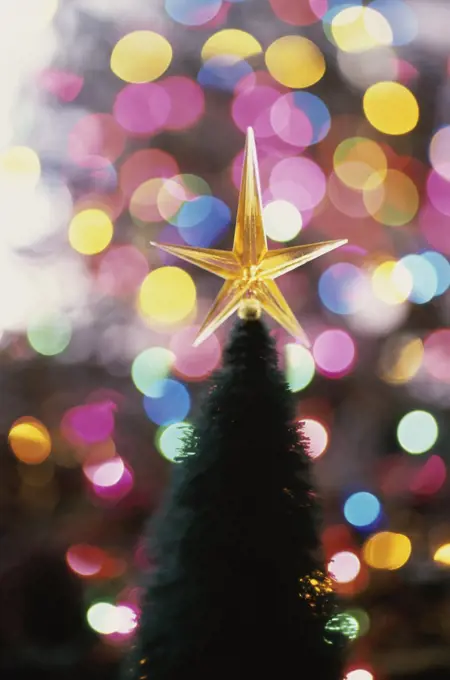 Close-up of a Christmas star on top of Christmas tree