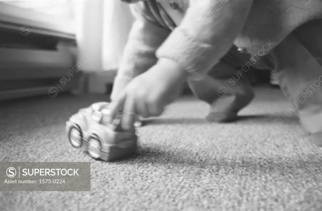 Toddler playing with toy