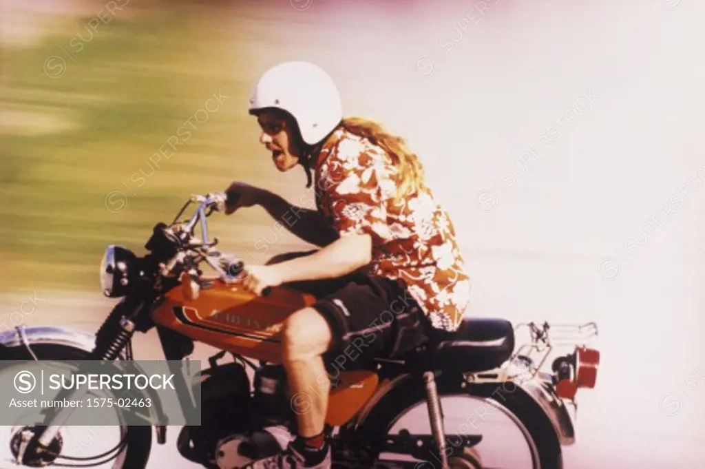 Man riding old motorcycle