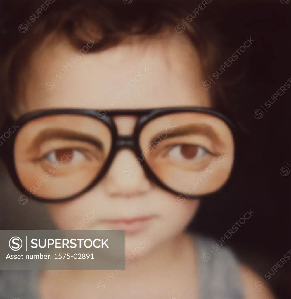 Toddler wearing funny glasses