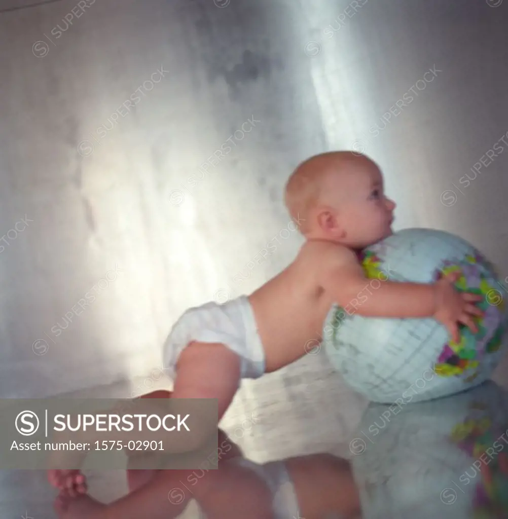 Baby holding Globe