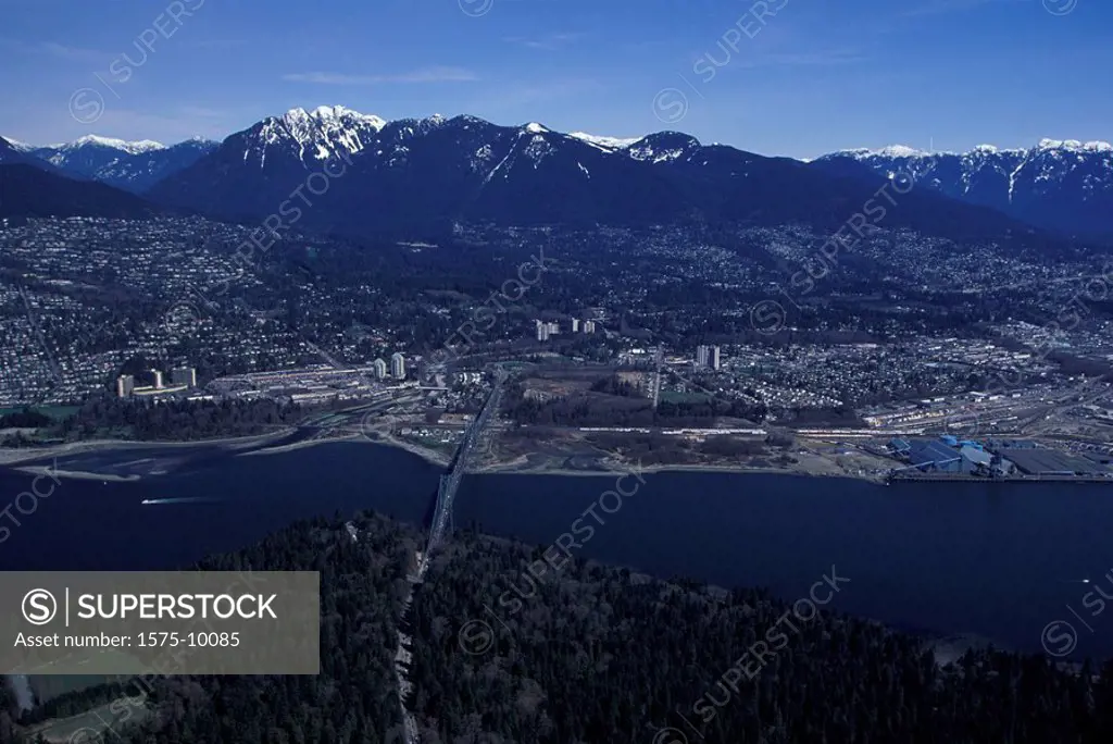 Aerial of First Narrows from above Stanley park looking towards the north shore mountains. Vancouver, British Columbia, Canada