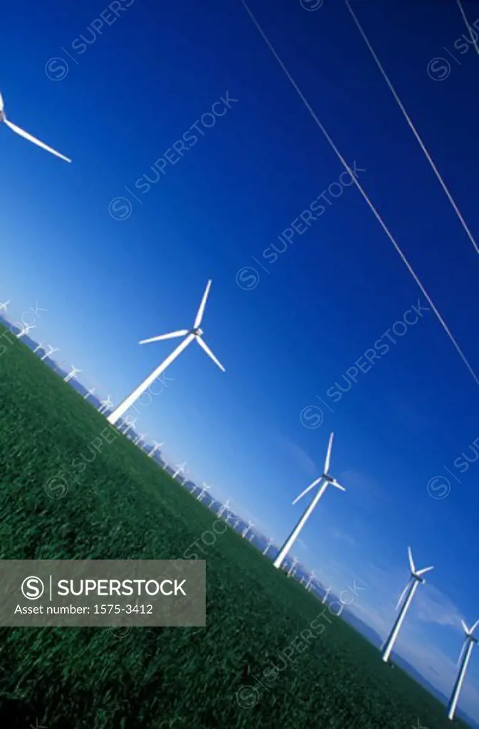 Metal Windmills creating clean electric energy, Pincher Creek, Alberta