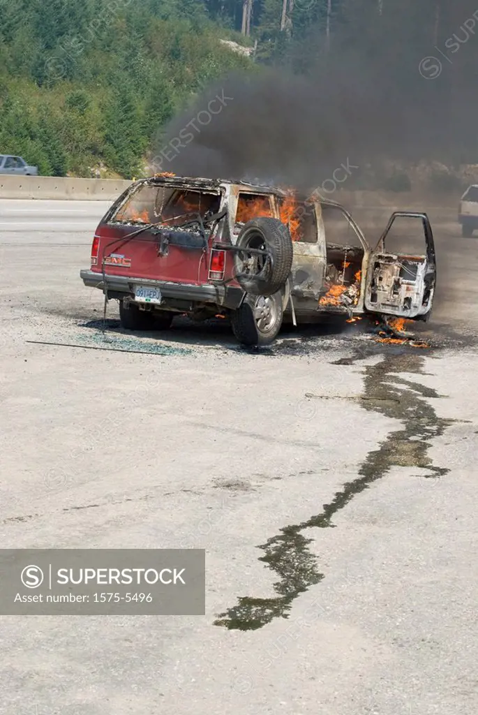 SUV GMC on fire beside the highway. Coquihalla Highway, Merritt BC, Canada