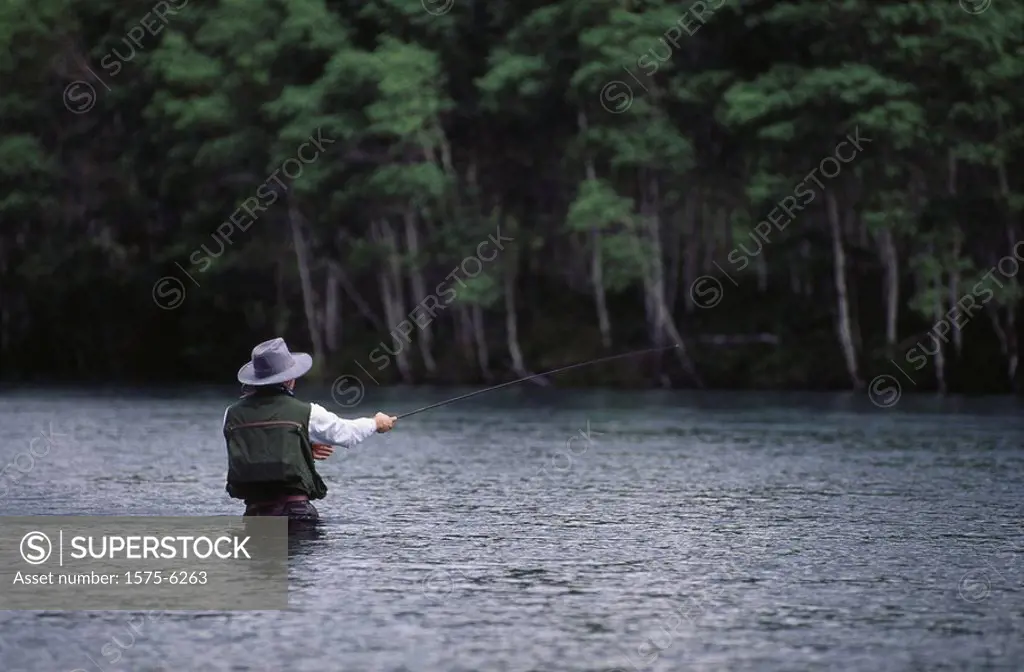 Fisherman fly fishing, Chilko River, Cariboo, BC