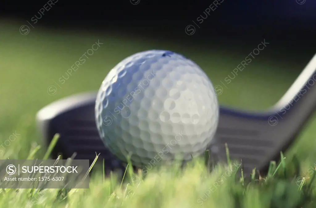 Close up of golf club and ball
