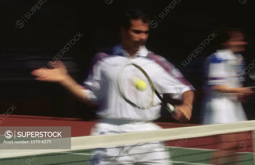 Tennis _ backhand at the net, blurred motion.