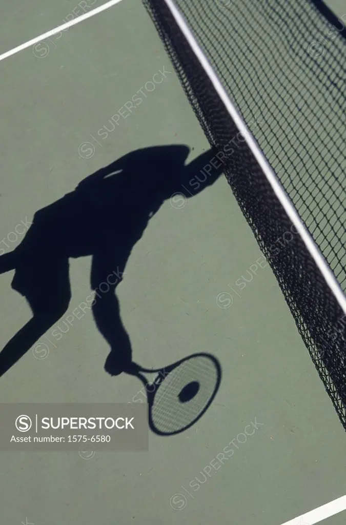Tennis player and shadow