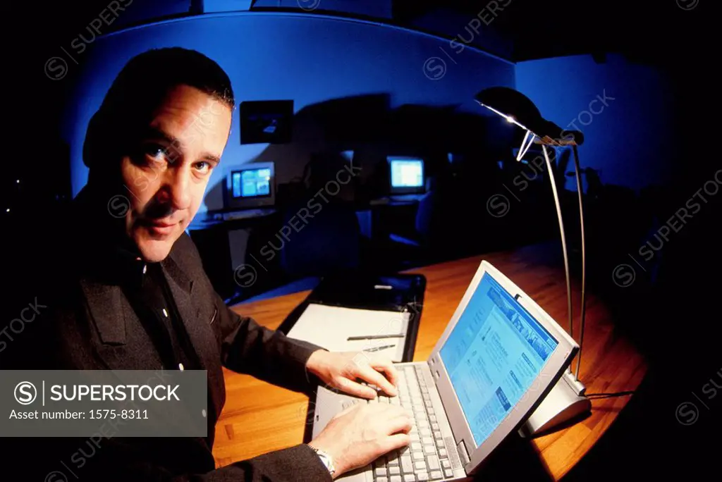 Businessman working at laptop computer