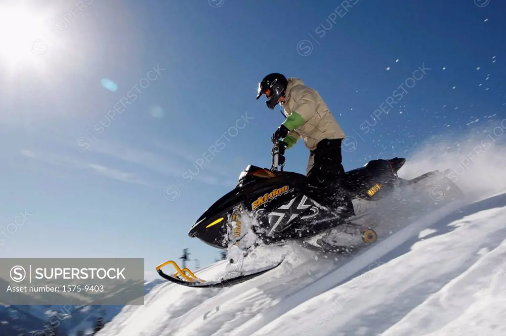 Man on snowmobile, Whistler, British Columbia, Canada